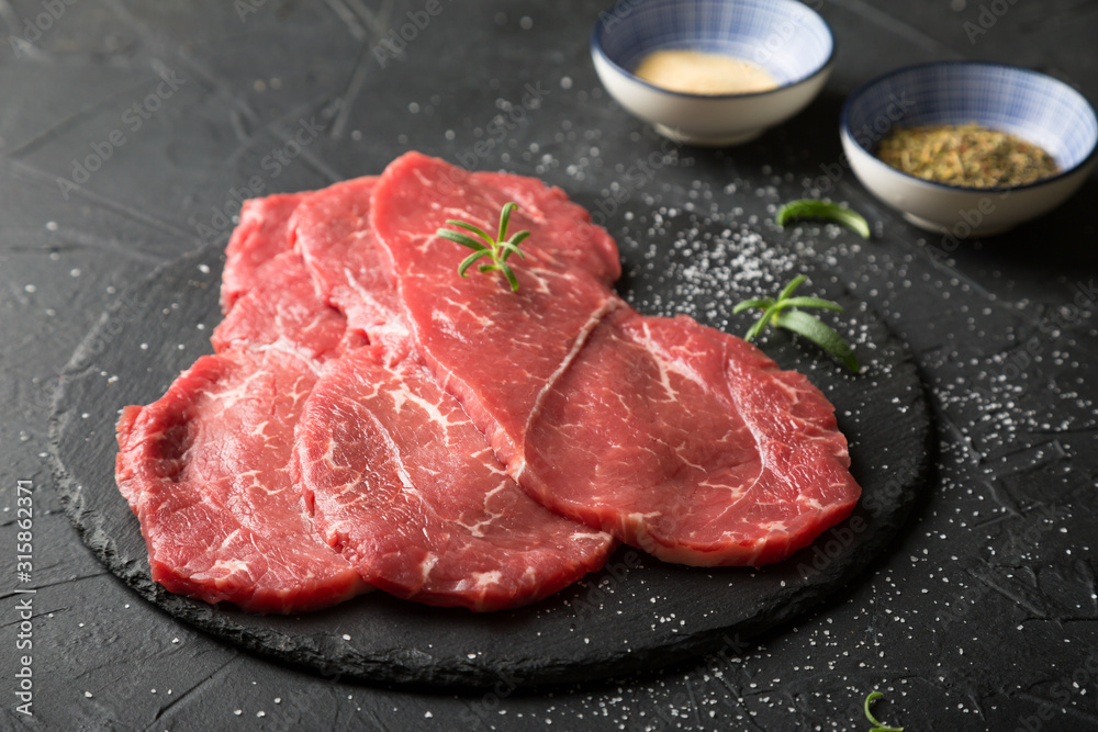 Fresh, thin beef steak with spices Fresh, thin beef steak with spices