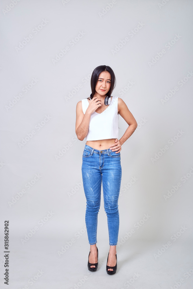 Asian woman wearing headphones dancing active Asian woman wearing headphones dancing active