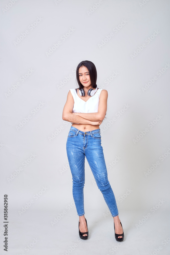 Asian woman wearing headphones dancing active Asian woman wearing headphones dancing active