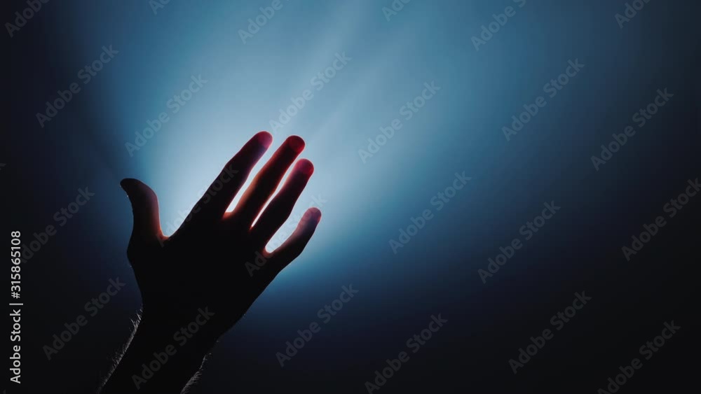 The helping hand stretches from top to the man's hand