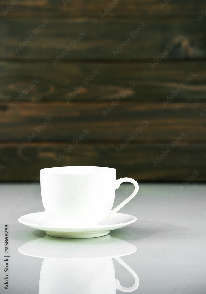 Coffee cup on table with wood background Coffee cup on table with wood background
