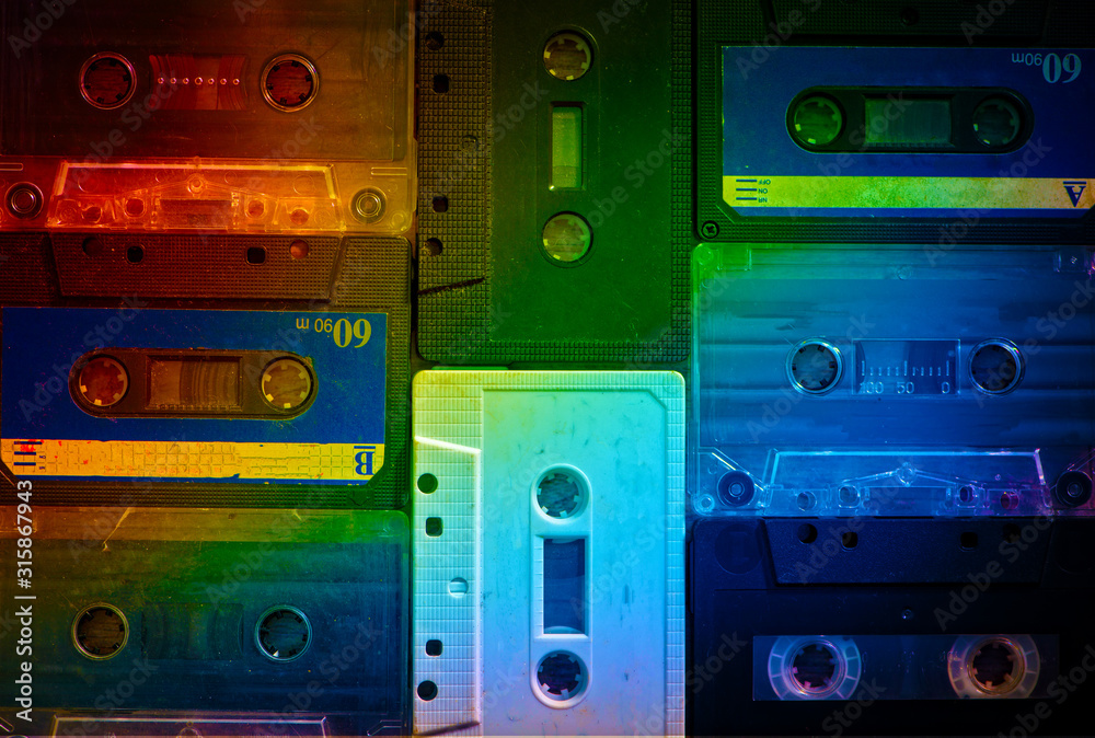 Old cassette tapes with a wooden background