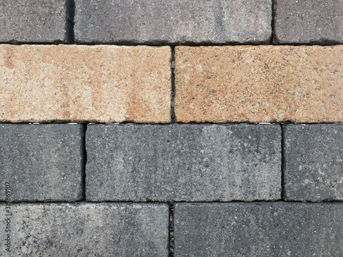 Bricks, paving stones, stacked as a wall, as a background