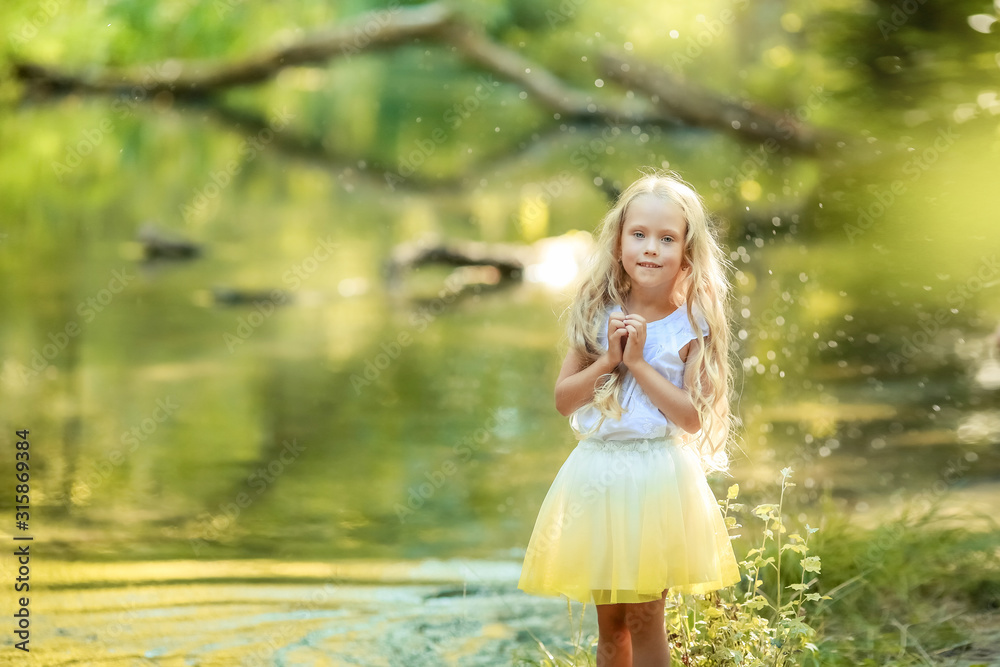 Beautiful baby girl with long white hair in the forest. Beautiful baby girl with long white hair in the forest.
