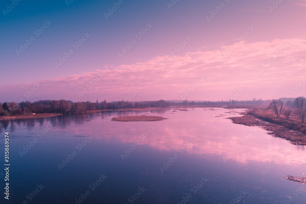 View from above of countryside and river et sunset. Nature landscape. Early spring