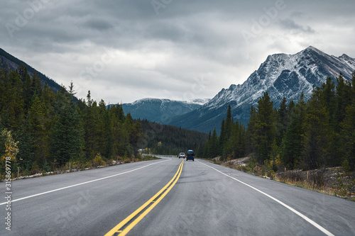 Road trip with Rocky mountains in autumn forest on gloomy at Banff national park © Mumemories