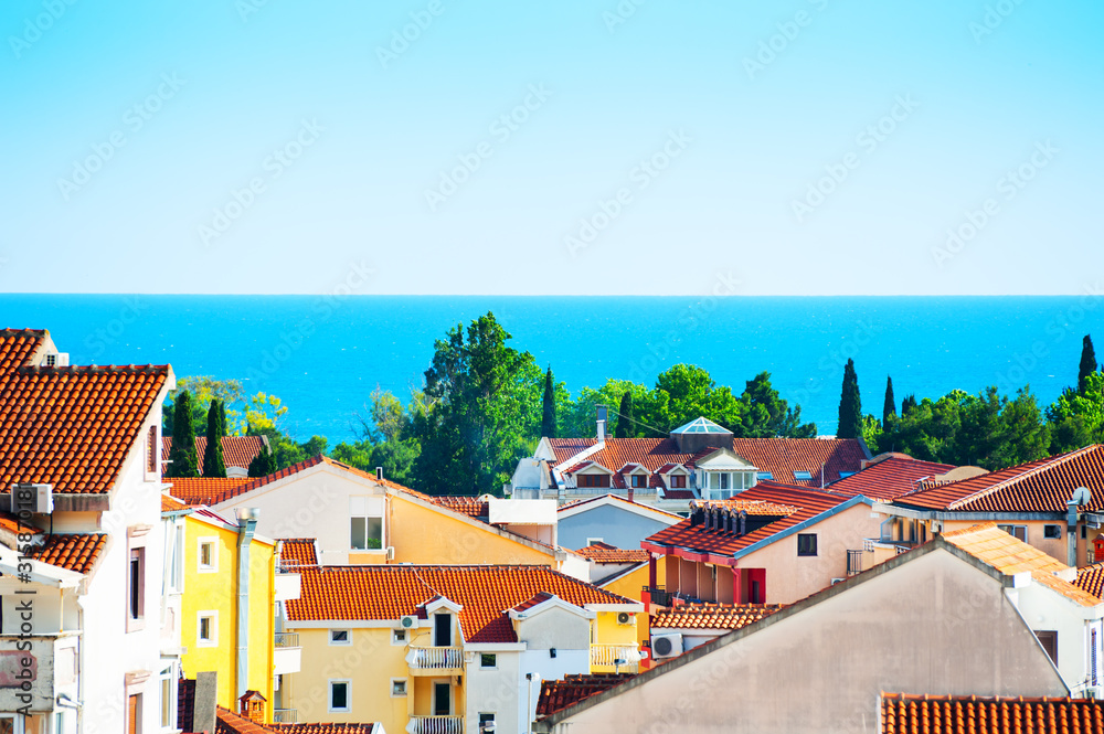 View of the sea and the rooftops in Budva, Montenegro. Selective focus. Summer travel destination.