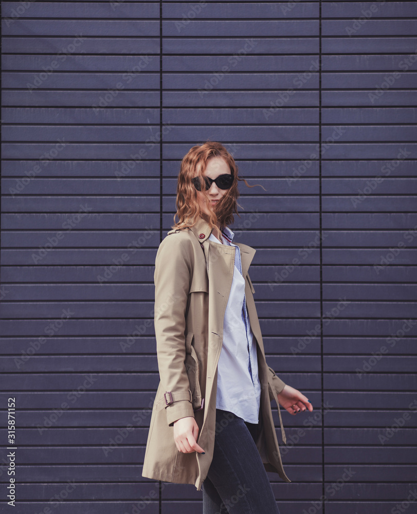 Outdoors portrait fashion woman model in trendy coat Outdoors portrait fashion woman model in trendy coat