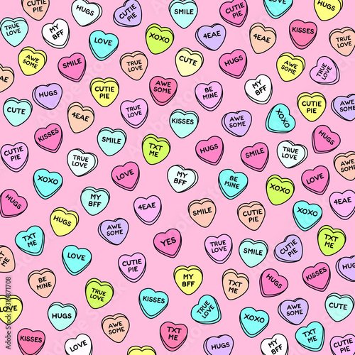 Colorful heart candy on pink background. Set of conversation sweets for valentine’s day. photo