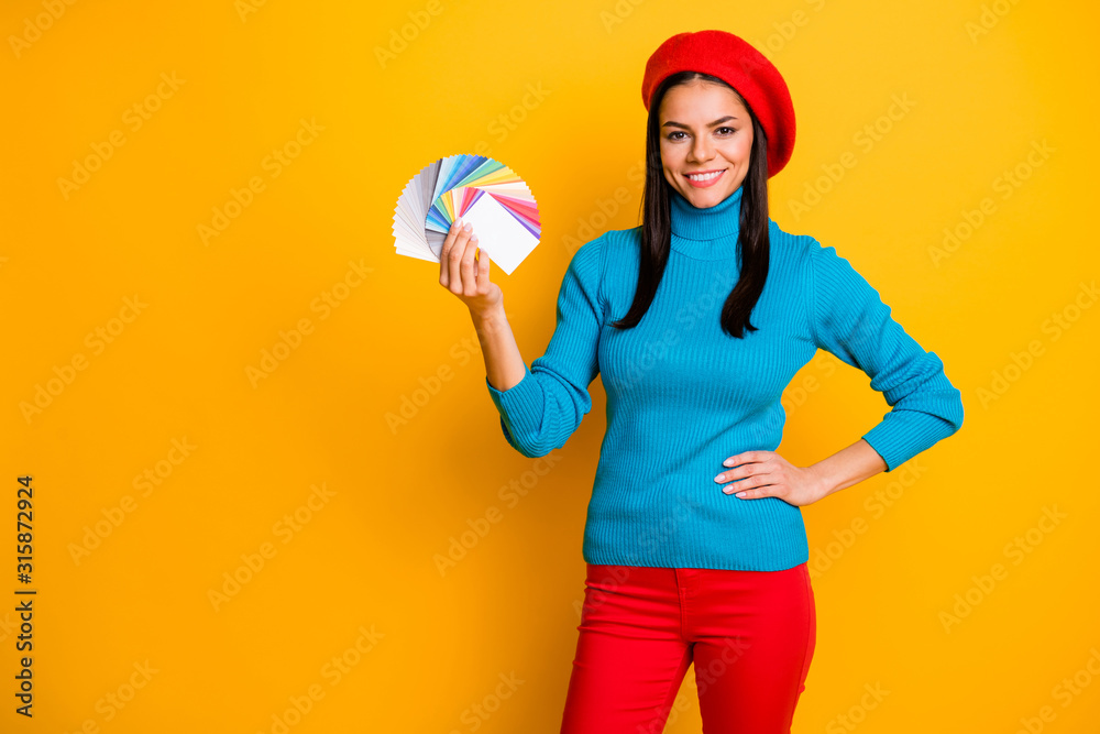 Portrait of her she nice attractive lovely confident cheerful cheery girl designer holding in hand palette different color type styling isolated on bright vivid shine vibrant yellow color background Portrait of her she nice attractive lovely confident cheerful cheery girl designer holding in hand palette different color type styling isolated on bright vivid shine vibrant yellow color background
