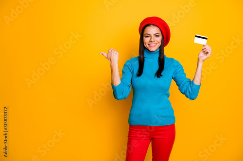 Portrait of her she nice attractive cheerful cheery girl showing atm plastic card online shopping fast shipping order service copy space isolated on bright vivid shine vibrant yellow color background © deagreez