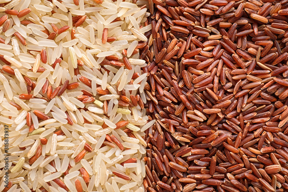 Mix of different brown rice as background, top view Mix of different brown rice as background, top view