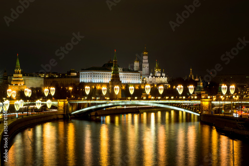the night lights of the Kremlin are reflected in the Moscow river