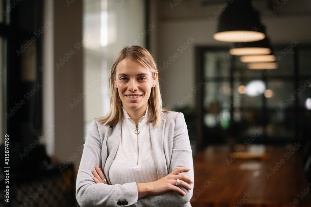 Portrait of a young businesswoman with crossed arms.  