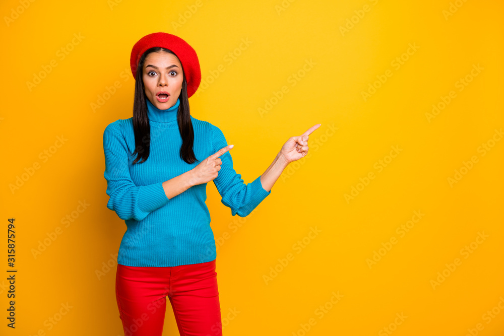 Portrait of her she nice attractive lovely amazed stunned girl pointing two forefingers copy empty blank place space ad advert isolated over bright vivid shine vibrant yellow color background Portrait of her she nice attractive lovely amazed stunned girl pointing two forefingers copy empty blank place space ad advert isolated over bright vivid shine vibrant yellow color background
