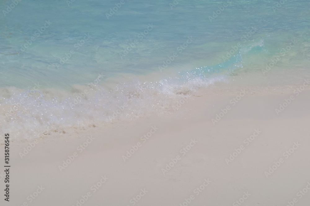 view of white sand beach and wave with blue-green sea background, Similan island, Mu Ko Similan National Park, Phang Nga, southern of Thailand.