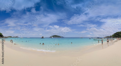 view panorama on white sand beach with blue green sea and blue sky background, Similan island, Mu Ko Similan National Park, Phang Nga, southern of Thailand.