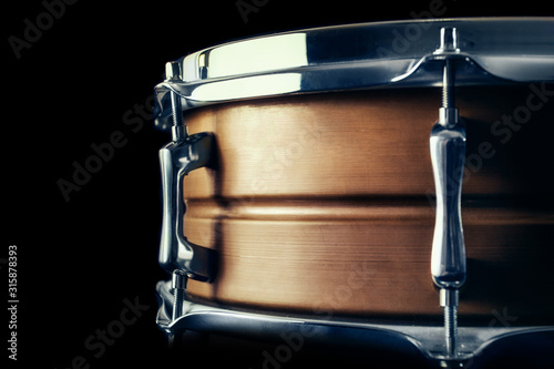 Close-up Drum set in a black background.