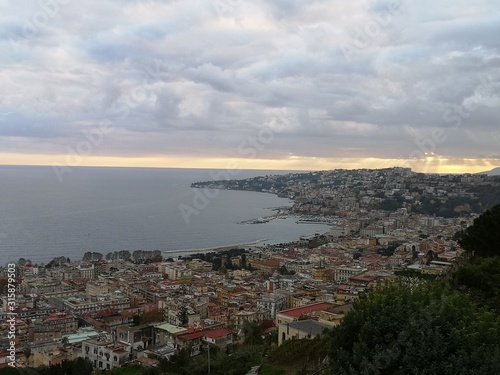 View of the city of Naples and the sea close to sunset time