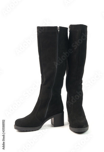 Elegant women's tall black winter high heeled boots isolated on white background