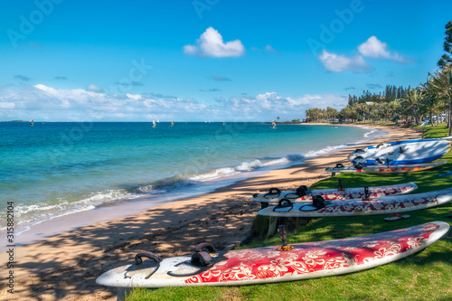 Windsurfing, sailing and paddling on the beach at Anse Vata Bay in Noumea, New Caledonia, French Polynesia, South Pacific Ocean.