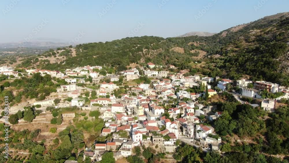 Drone Descending Fast Towards MOUNTAIN VILLAGE CHURCH CRETE GREECE