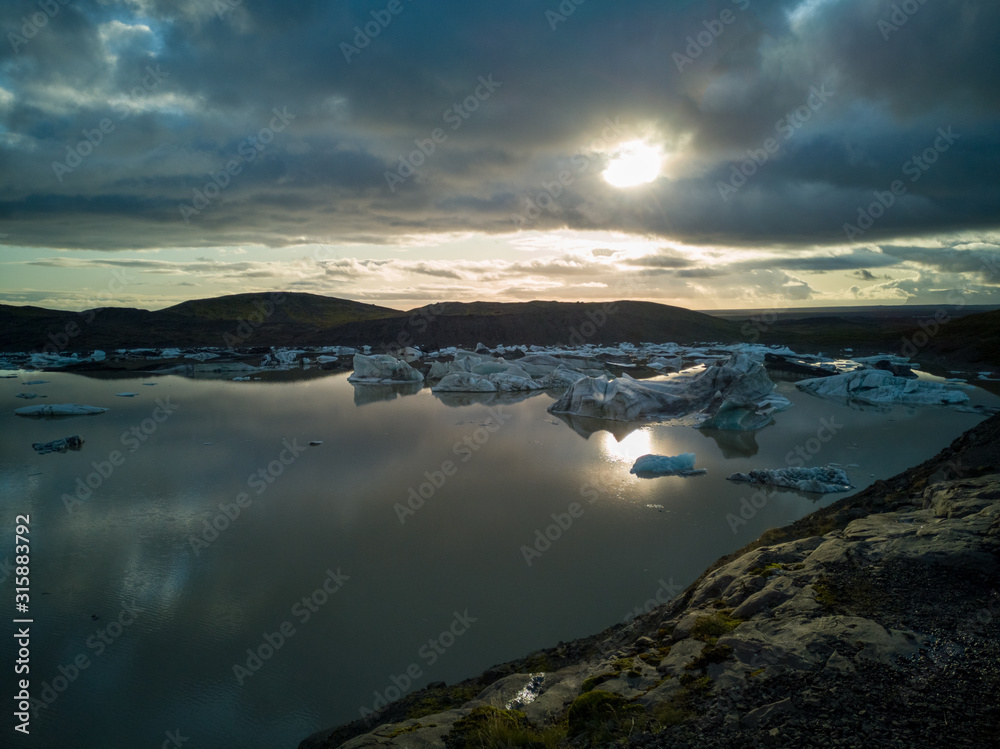 Lake with ice blocks at sunset in Iceland