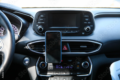 Mounting a smartphone in a car dashboard. © cherrydonut