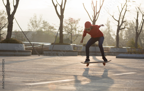 Skateboarder skateboarding at sunrise park © lzf