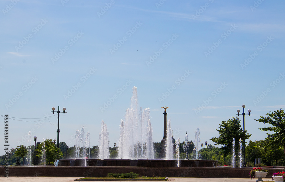 Yaroslavl. Park on Arrow. Fountain jets in the sun Yaroslavl. Park on Arrow. Fountain jets in the sun