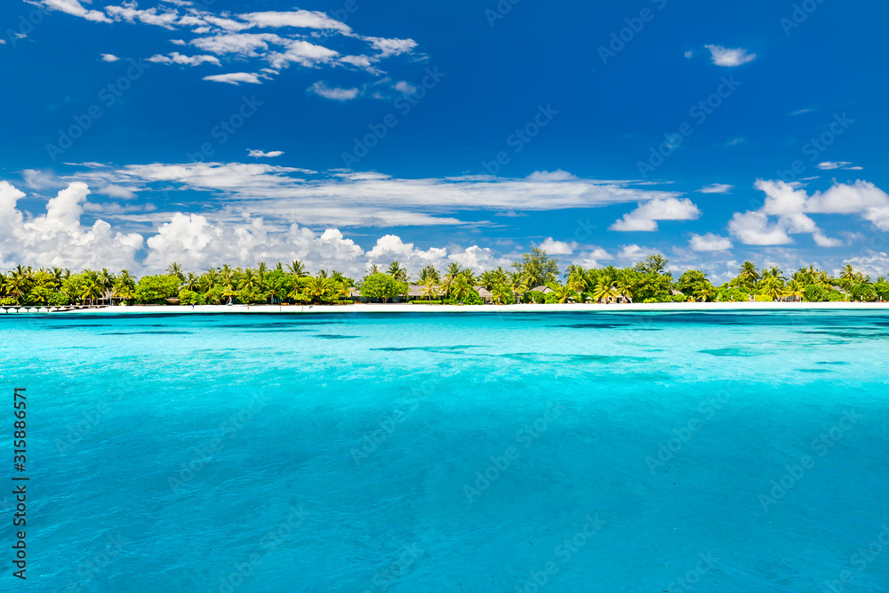 Fototapeta premium Maldives beach with luxurious water villas and loungers beautiful tropical scene. Luxury summer travel destination background concept. Beach mood for summer vacation or holiday design