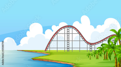 Scene with empty roller coaster track in the field