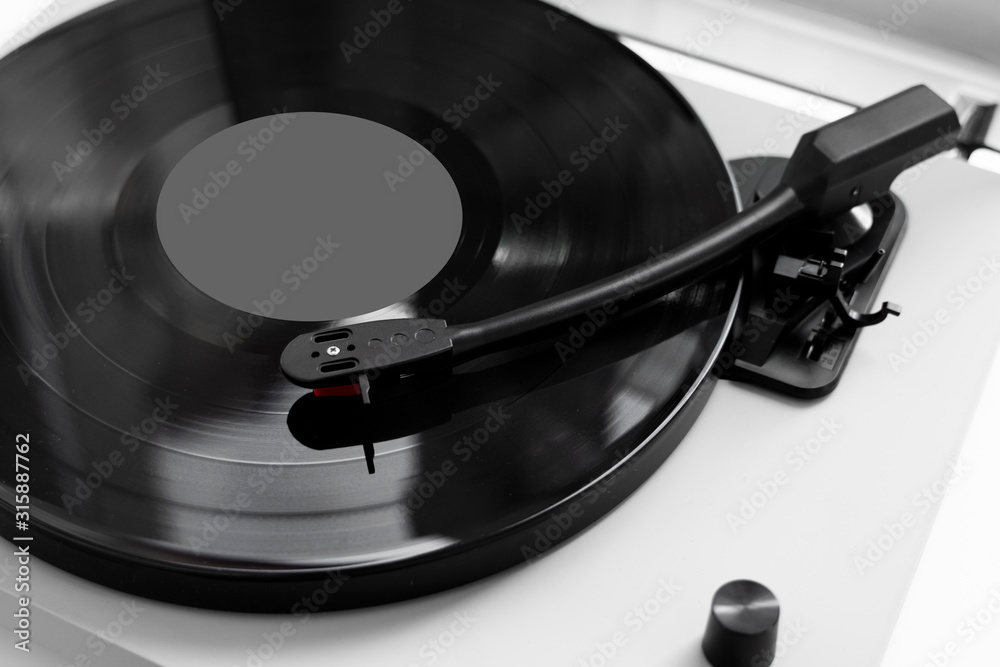Vinyl turntable on a white background. Retro audio equipment for vinyl disk. Vinyl turntable on a white background. Retro audio equipment for vinyl disk.