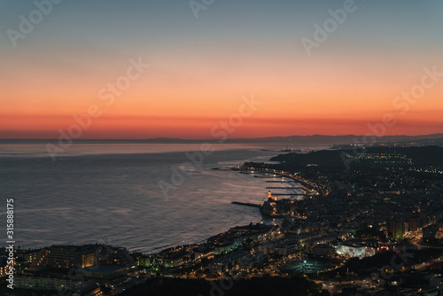 Scenic view over beach town by night