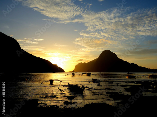 Sunset ombre sky over a sea of bangkas in El Nido Palawan Phillipines
