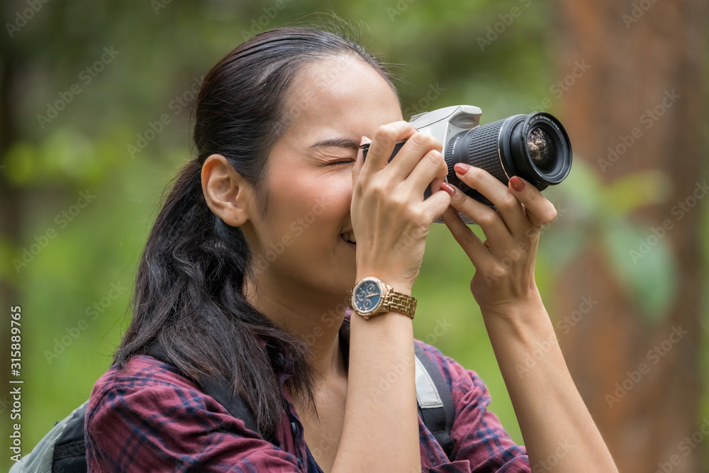 Photographer woman asian woman taking a photos with dslr camera professional photography during her vacation, Concept of woman solo travel