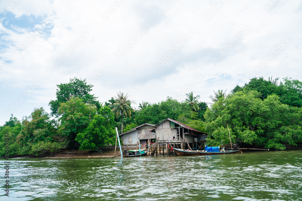 Abandoned house in tropical mangrove forest island in sea Abandoned house in tropical mangrove forest island in sea