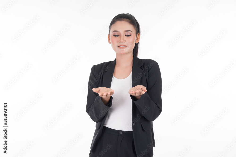 An attractive woman wearing business attire waving her hands in the air navigating on an invisible screen isolated on white. Suitable for image cut out and manipulation works for technology, business. An attractive woman wearing business attire waving her hands in the air navigating on an invisible screen isolated on white. Suitable for image cut out and manipulation works for technology, business.