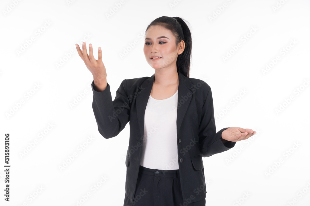 An attractive woman wearing business attire waving her hands in the air navigating on an invisible screen isolated on white. Suitable for image cut out and manipulation works for technology, business. An attractive woman wearing business attire waving her hands in the air navigating on an invisible screen isolated on white. Suitable for image cut out and manipulation works for technology, business.