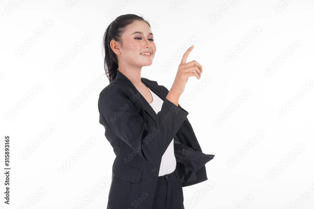 An attractive woman wearing business attire points her finger somewhere isolated on white background. Suitable for image cut out and manipulation works for technology, business or finance theme. An attractive woman wearing business attire points her finger somewhere isolated on white background. Suitable for image cut out and manipulation works for technology, business or finance theme.