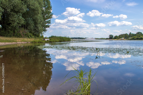 Fototapeta Naklejka Na Ścianę i Meble -  Bright summer day in the Strelka of Yaroslavl Beautiful landscaping of the Park on the embankment of the Volga and Kotorosl in Yaroslavl