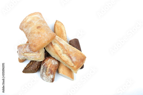 background of different bread on a white background top view with copy space