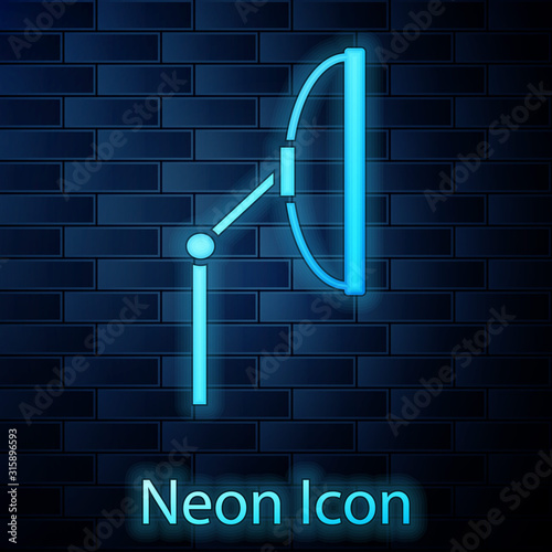 Glowing neon Windscreen wiper icon isolated on brick wall background. Vector Illustration