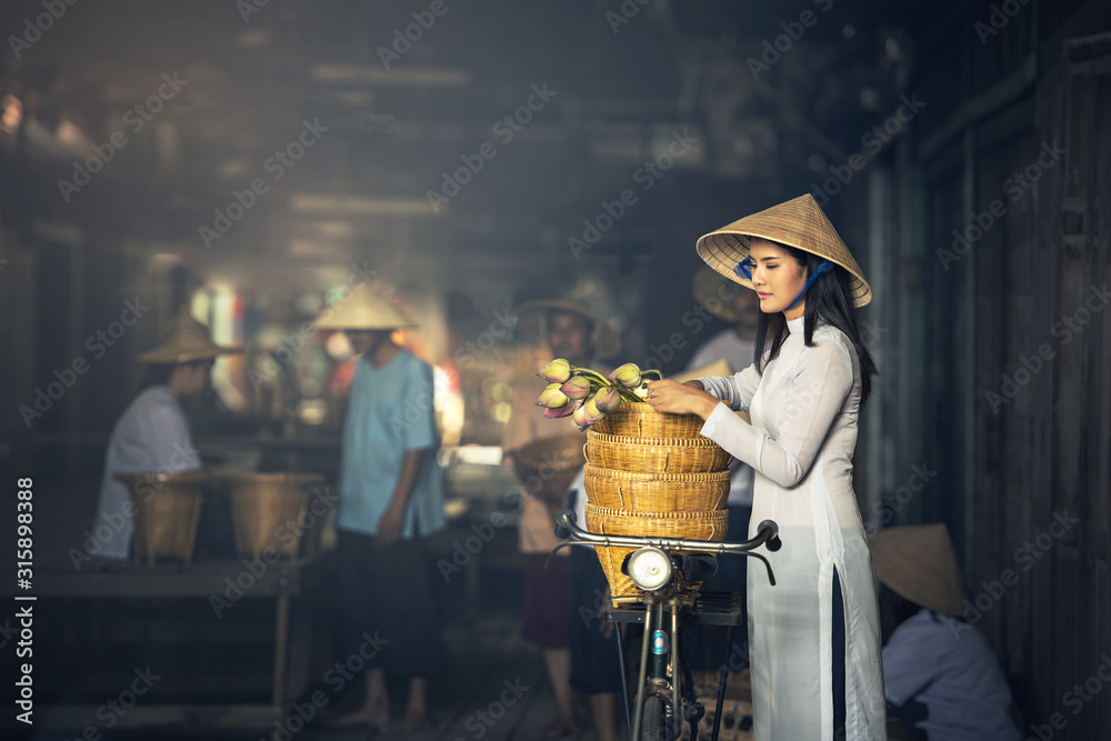 VIETNAM Beautiful women in Ao Dai Vietnam Traditional dress In market Concept portrait Ao Dai Vietnam.