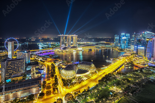Aerial view of Singapore business district and city at night in Singapore, Asia.