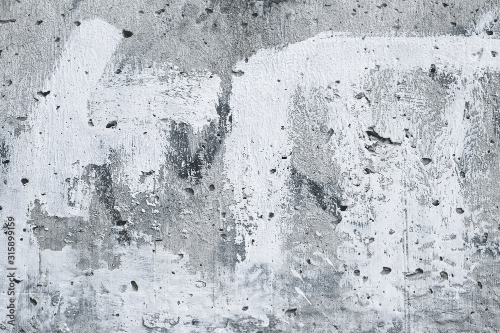 Obraz premium Gray stained concrete wall, white painted wallpaper. Abstract art, urban background. Old vintage paper texture. Retro grey structure, architecture backdrop. Cement, stone wall surface.