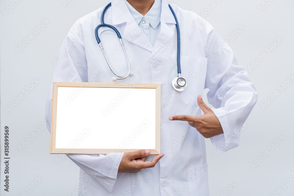 professional female doctor in white coat over white isolated background and Pointing to white blank board. Concept of healthcare, science and medicine concept professional female doctor in white coat over white isolated background and Pointing to white blank board. Concept of healthcare, science and medicine concept
