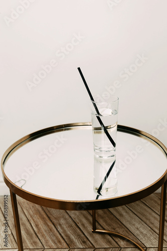 A glass with water on a white background.