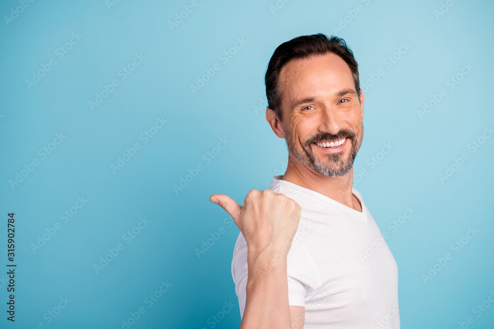 Close-up portrait of his he nice attractive cheerful cheery glad guy showing copy empty blank space presentation isolated on bright vivid shine vibrant teal green blue turquoise color background Close-up portrait of his he nice attractive cheerful cheery glad guy showing copy empty blank space presentation isolated on bright vivid shine vibrant teal green blue turquoise color background