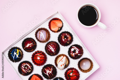 Box of Tasty Chocolate Candies and Cup of Coffee Homemade Cocolate Candy Tasty and Beautiful Dessert Top View Long